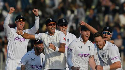 England players celebrate after the dismissal of Pakistan's Salman Ali Agha during the fifth and final day of the first Test at the Rawalpindi Cricket Stadium on December 5, 2022. AFP