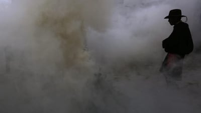 Tibetan pilgrims seen in the smoke of a bonfire offering ritual outside Sera Monastery in Lhasa, Tibet Autonomous Region, China. Sera Monastery is known as one of the ‘great three’ Gelug university monasteries of Tibet founded in 1419. Tibetan Buddhism continues to be a source of political dispute in Tibet, where the population maintains its faith and beliefs while the Chinese government tries to keep its political ramifications under control. EPA