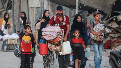 Displaced Palestinians flee an area of Khan Younis after the Israeli army issued an eviction order in July. AFP