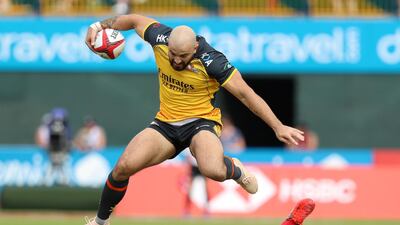 Tim Richards of Hurricanes evades a Bahrain tackler.