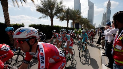 Cyclists start the second stage of the 2014 Dubai Tour cycling race.