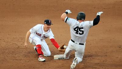 New York Yankees' Luke Voit (right) in action with Boston Red Sox' Brock Holt during the MLB London Series Match at The London Stadium. PRESS ASSOCIATION Photo