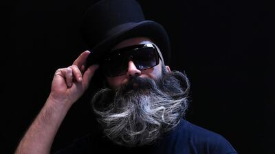 A participant of the international World Beard and Moustache Championships poses before taking part in one of the 17 categories of beard and moustache styles competing in Antwerp, Belgium. Reuters