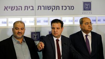 Members of the Joint List Ayman Odeh, center, speaks to the press in the presence of Ahmad Tibi, right, and Mansour Abbas following their consulting meeting with Israeli President Reuven Rivlin. AP