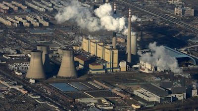 The chimneys of a power plant emit smog on the outskirts of Beijing in January 2016. Kim Kyung-Hoon / Reuters