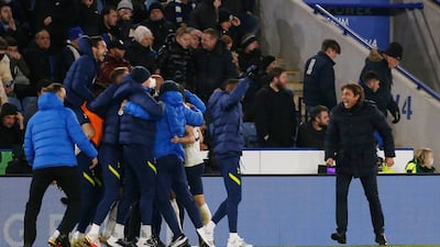 Tottenham manager Antonio Conte, right, and Spurs players and staff celebrate the victory. Reuters