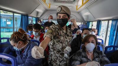 American citizens who were stranded abroad arrive at the Lebanese border coming from Syria on their way to Beirut airport to return to the US on a US cargo plane. EPA