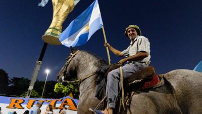 Argentina fans await the arrival of the players after their World Cup win. AFP