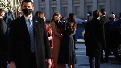 Ashley Biden, daughter of US President Joe Biden, adjusts the hair of her niece, Natalie Biden, before the inauguration. AFP