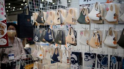 Face masks with dogs and cats illustrations are displayed at the 'Interpets' international pet fair in Tokyo, Japan. As the coronavirus pandemic is limiting access from abroad, some 300 exhibitors based in Japan will present their products to business visitors and pet lovers until 04 April at the event, which is the largest international trade fair in the Japanese pet market. With the COVID-19 pandemic, pets are giving comfort to people who are spending more time home due to lockdowns and telework, boosting the pet products market. EPA