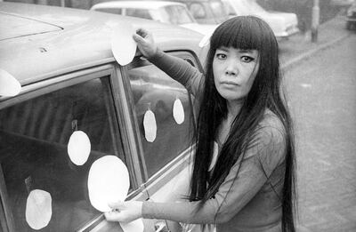 Artist Yayoi Kusama next to her “Dot Car”(1965). Photo credit: Harrie Verstappen