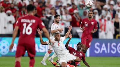 UAE's Ali Salmeen battles with Qatar's Almoez Ali during their Asian Cup semi-final.