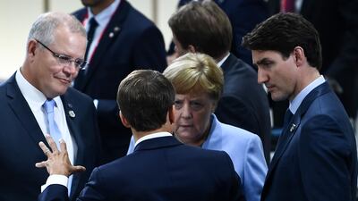 France's President Emmanuel Macron, front, speaks with Australia's Prime Minister Scott Morrison, left; Germany's Chancellor Angela Merkel, centre, and Canada's Prime Minister Justin Trudeau during a meeting. AFP