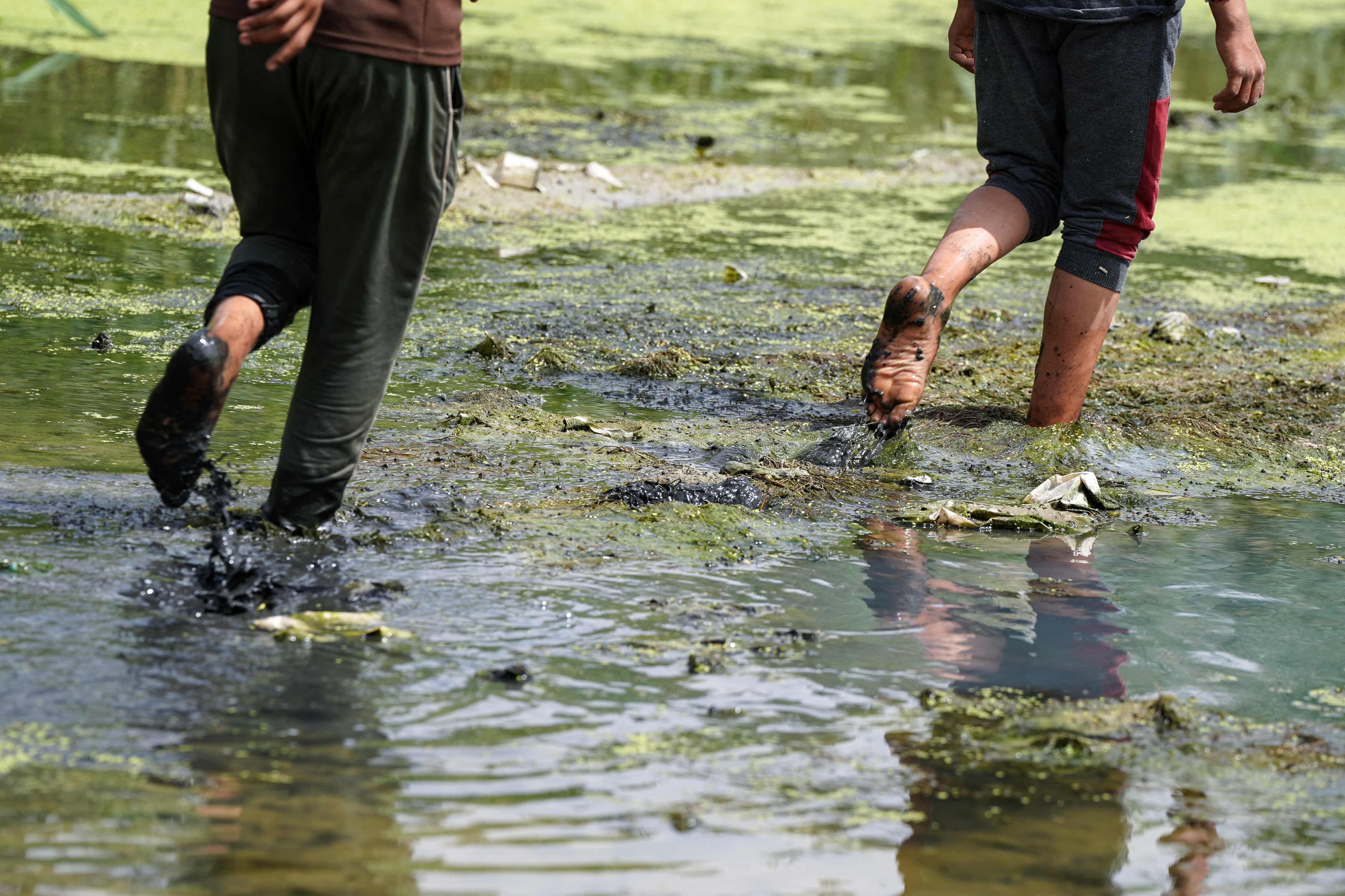Children continued to play in the streams and rivers of Mishkhab despite nature's inability to provide them with adequate water