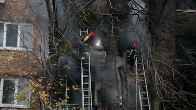 Firefighters work to put out a fire in a residential building hit by a Russian strike. Reuters
