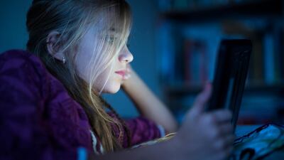 Traditional pastimes such as reading are being pushed aside as children spend hours glued to theor phones checking their social media accounts. Getty