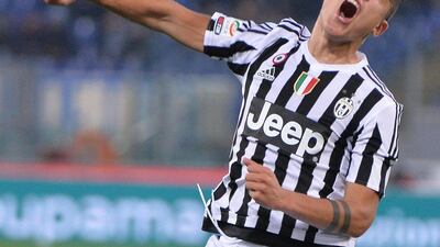 Juventus player Paulo Dybala celebrates after scoring against Lazio on Friday night in his team's Serie A victory. Maurizio Brambatti / EPA / December 4, 2015