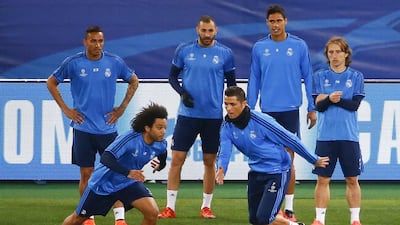 Real Madrid's Cristiano Ronaldo (front right) and Marcelo (front left) warm up during a training session prior to their Champions League match against AS Roma at the Olympic stadium in Rome, Italy February 16, 2016. REUTERS/Tony Gentile
