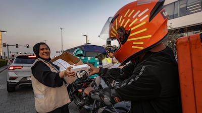 Emirates Red Crescent and Dubai Police hand out iftar boxes to motorists at the intersection of Al Safa Street and Al Multaqa Street next to City Walk in Dubai before sunset. All photos: Antonie Robertson / The National
