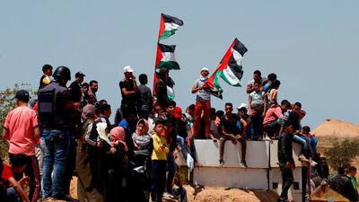 Palestinian demonstrators gather east of Khan Yunis in the southern Gaza Strip during a protest marking 71th anniversary of 'Nakba'. AFP