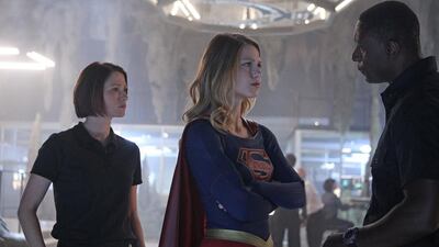 Chyler Leigh, left, as the Earth-born sister of Supergirl, played by Melissa Benoist, centre, and David Harewood as Hank Henshaw, who leads the DEO. Getty Images