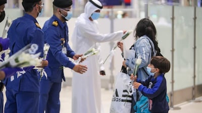 Passengers from Beirut are presented with flowers on arrival at Dubai International Airport last night. Courtesy: Dubai Customs