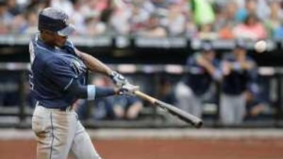 Tampa Bay Rays' BJ Upton doubles to bring home two runs during the fifth inning against the New York Mets.