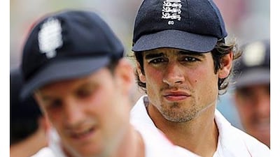 The new captain Alastair Cook looks over the shoulder of Andrew Strauss, replacing him for the tour to Bangladesh.