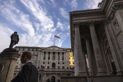 A commuter passes the Bank of England in London. Investors are leaning toward another quarter-point increase in interest rates on Thursday. Photographer: Jason Alden / Bloomberg