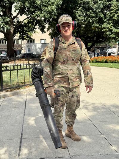 A member of the National Guard uses a leaf blower to clean up a park in central Washington. Thomas Watkins / The National
