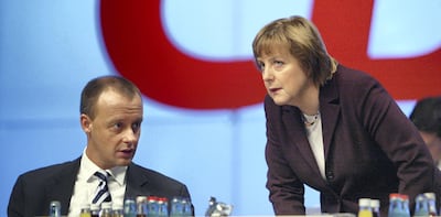 Friedrich Merz and Angela Merkel at a CDU party congress in 2003. Getty