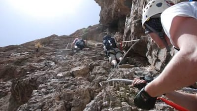 Steel cables safeguard climbers on the precarious Sticks Route.