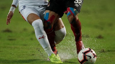 The rain-soaked pitch during the match. Reuters