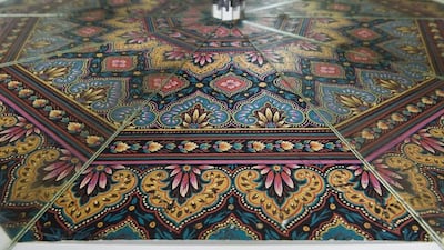 Above, mirrors are positioned to picture a umbrella that would be made at Piganiol's facility. Thierry Zoccolan / AFP
