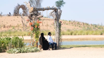 Families enjoy the surroundings at Dubai's Love Lake, Al Qudra. Reem Mohammed / The National