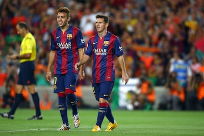 Munir El Haddadi playing alongside Lionel Messi at Barcelona in 2014. Alamy