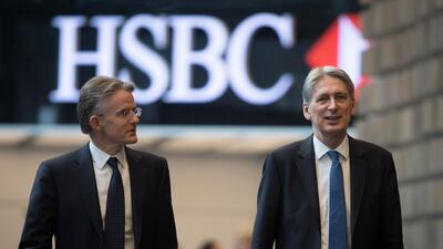 Britain's Finance Minister Philip Hammond, with CEO John Flint, at HSBC headquarters in Canary Wharf in London: a report says companies in Britain and the EU face an extra 58bn pounds in annual costs if there is a no-deal Brexit, with Britain’s vast financial sector set to be the worst-hit industry. Stefan Rousseau / Reuters