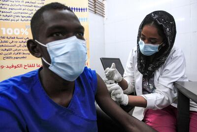 A medical worker receives a dose of the Oxford-AstraZeneca COVID-19 coronavirus vaccine at the Jabra Hospital for Emergency and Injuries in Khartoum. Ebrahim Hamid / AFP