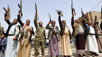 Supporters of Houthi rebels shout slogans and hold up weapons during a gathering to mobilise more fighters into the port city of Hodeidah, in Sanaa, Yemen, on June 25, 2018. Yahya Arhab / EPA
