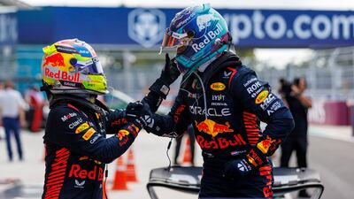 Red Bull driver Max Verstappen, right, celebrate with teammate Sergio Perez after the race. AFP