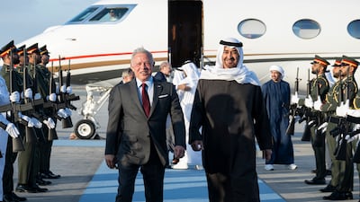 ABU DHABI, UNITED ARAB EMIRATES - March 25, 2025: HH Sheikh Mohamed bin Zayed Al Nahyan, President of the United Arab Emirates (R), receives HM King Abdullah II, King of Jordan (L), at Al Bateen Airport. ( Abdulla Al Neyadi / UAE Presidential Court ) ---