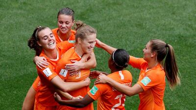 Vivianne Miedema celebrates scoring Netherlands' third goal against Cameroon with Jill Roord, Lieke Martens and other teammates. Phil Noble / Reuters
