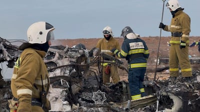 Emergency specialists work at the crash site. EPA