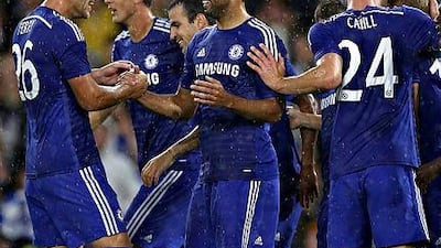 Diego Costa, centre, of Chelsea celebrates scoring his 2nd goal with his team mates during the pre-season friendly match between Chelsea and Real Sociedad at Stamford Bridge on August 12, 2014 in London, England. (Photo by Steve Bardens/Getty Images)