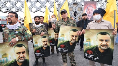 Mourners at Mousavi's funeral in Tehran on Thursday. AFP