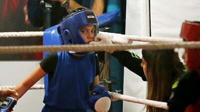 A Palestinian girl takes part in a rare boxing championship in Gaza City. Reuters