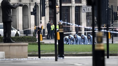 Police forensic officers work in Parliament Square following an attack outside the Houses of Parliament in Westminster in March 2017 in London, England. Getty Images