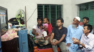 Relatives of Mustafizur Rahman watch an Indian Premier League (IPL) cricket match in his home in Satkhira, south-west of Dhaka. Kazi Santo / AFP