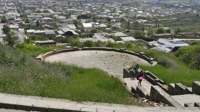 People visit a viewing platform at the Naryn-Kala fortress in the Caspian Sea coastal city of Derbent, in Dagestan, Russia on May 15, 2010. Reuters