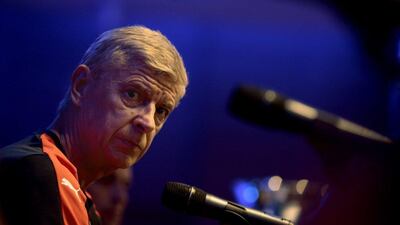 Arsenal manager Arsene Wenger answers questions at a media conference in Singapore during the team's Asian tour on Tuesday. Wallace Woon / EPA / July 14, 2015